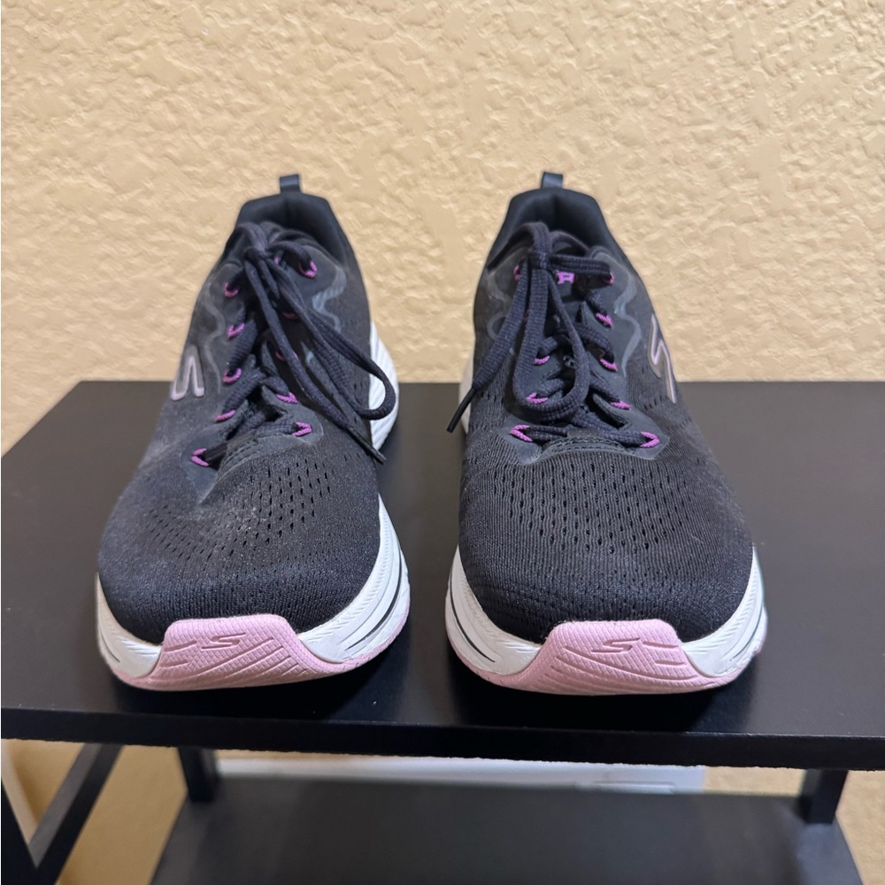 Skechers max cushion walking shoes.